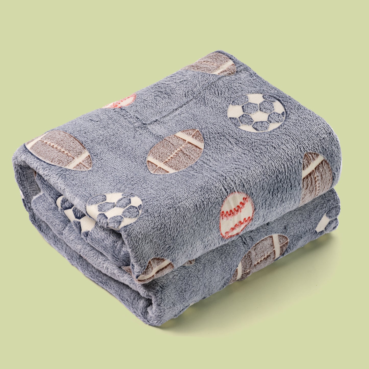 Sports blanket glow in the dark folded over colour background